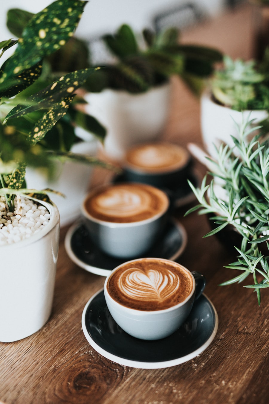A warm mug of coffee surrounded by coffee beans